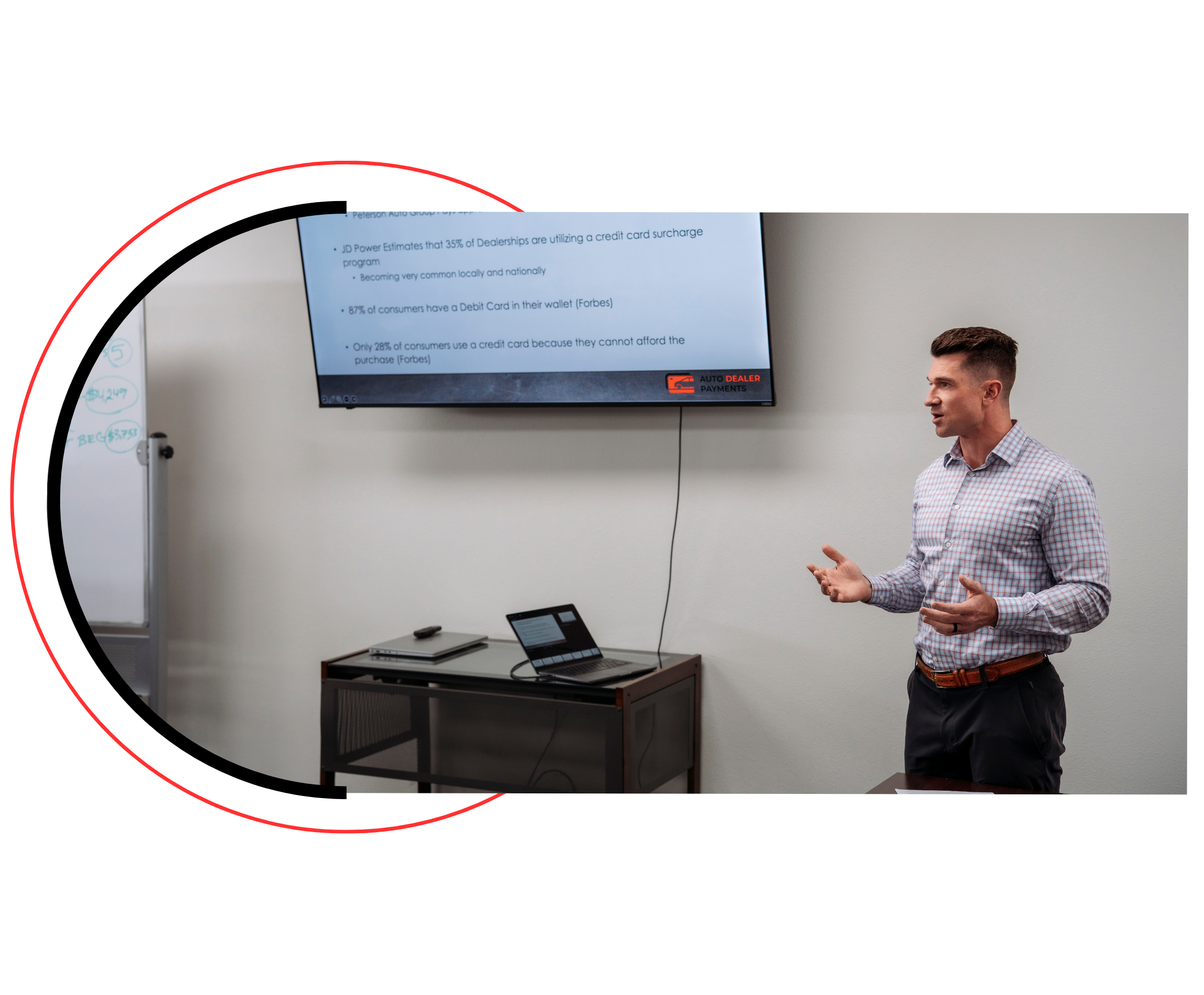 Credit card processor representative leading a staff training session on payment systems at a car dealership showroom, with employees gathered around a counter reviewing equipment and transaction procedures.